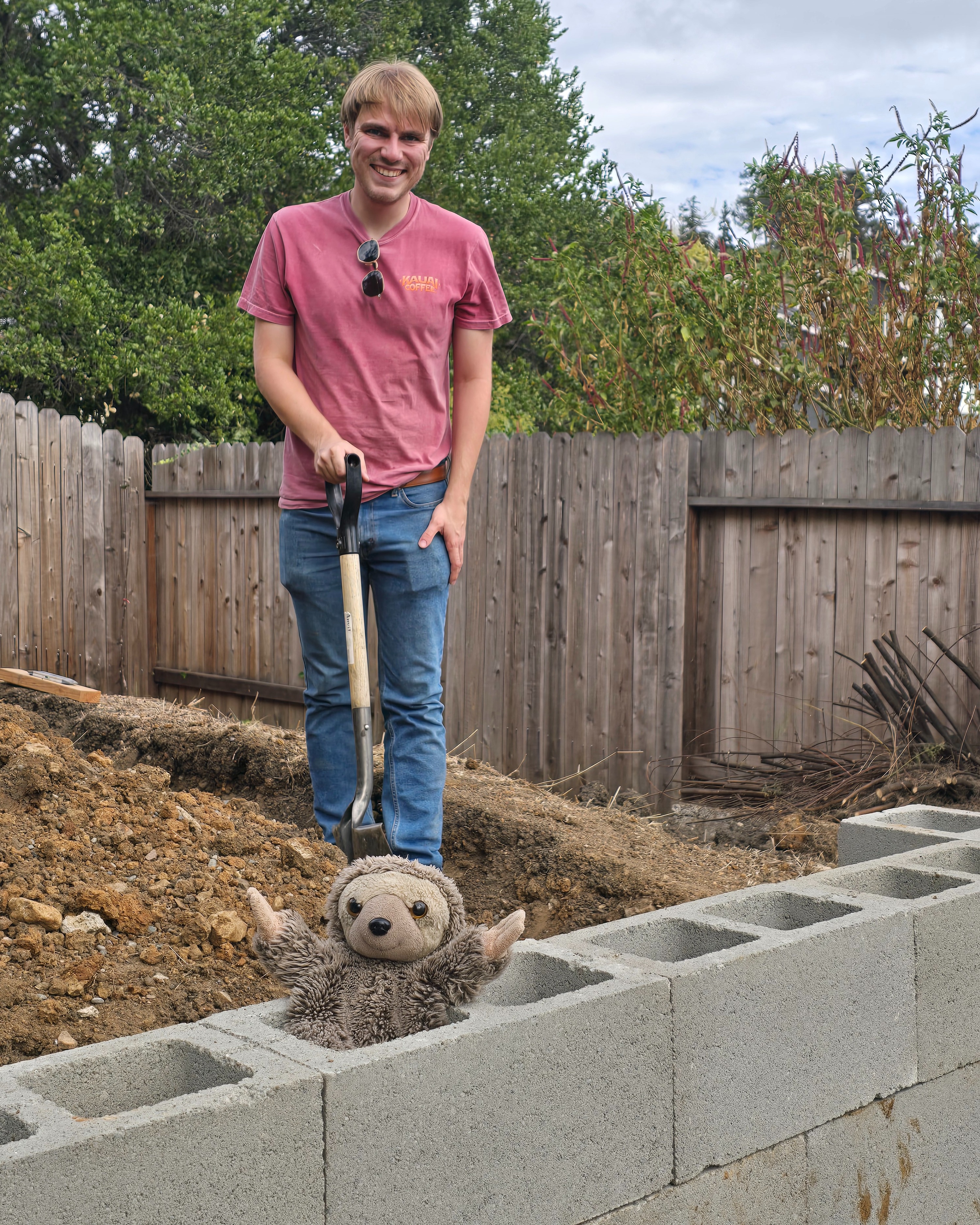 Block wall construction progress with helpers