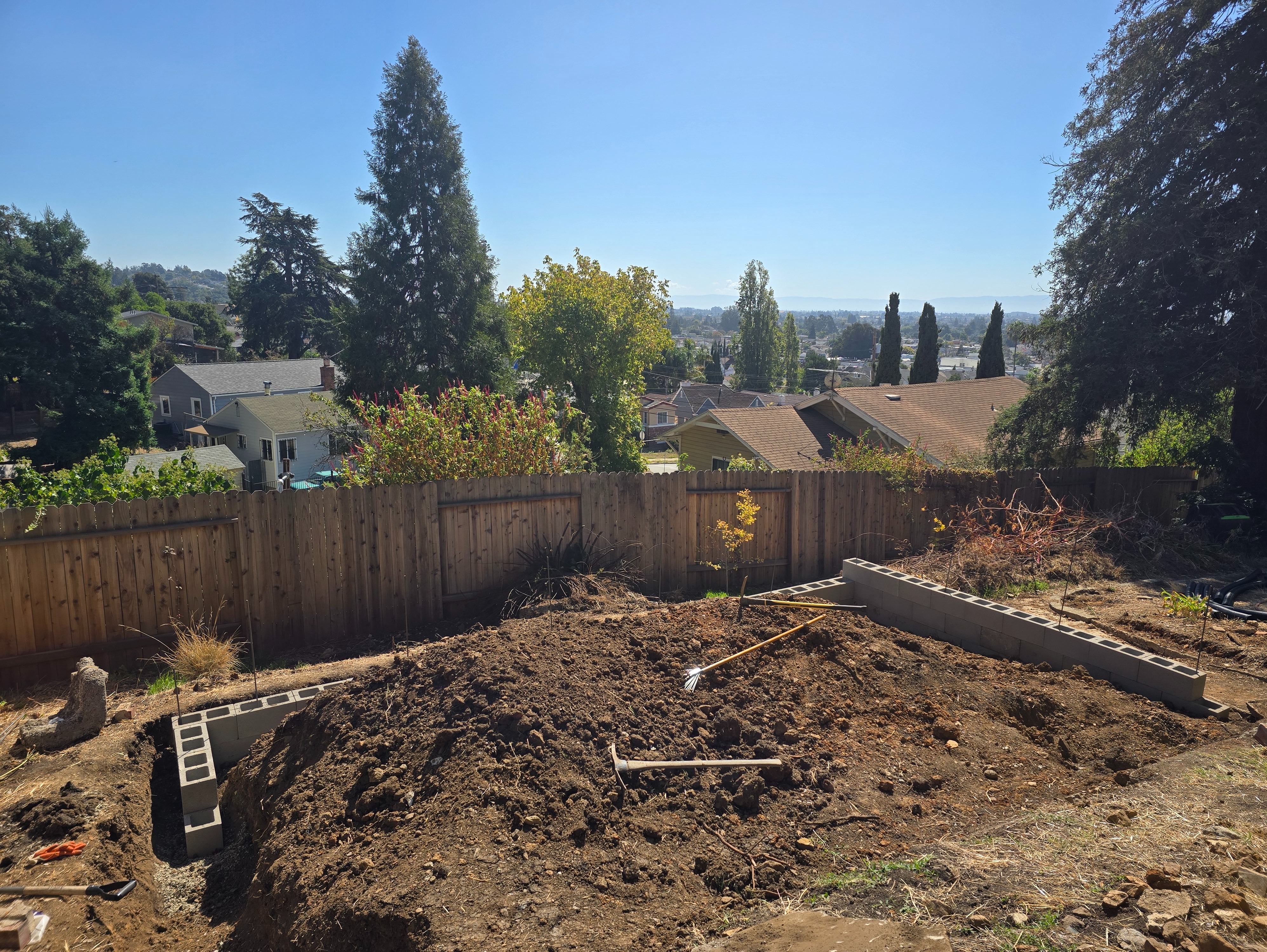 Breaking up the concrete terrace wall remnant