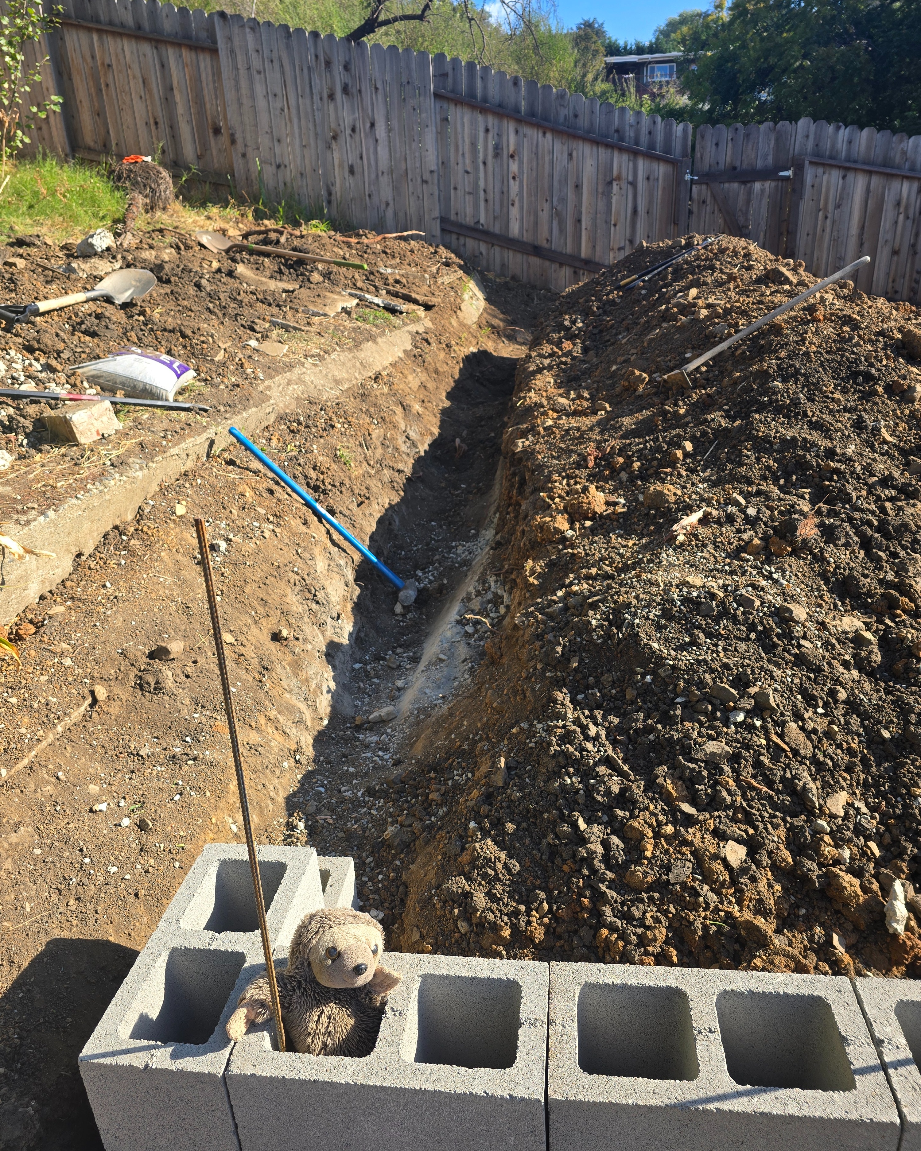 Wall adjusted to thread between concrete on either side