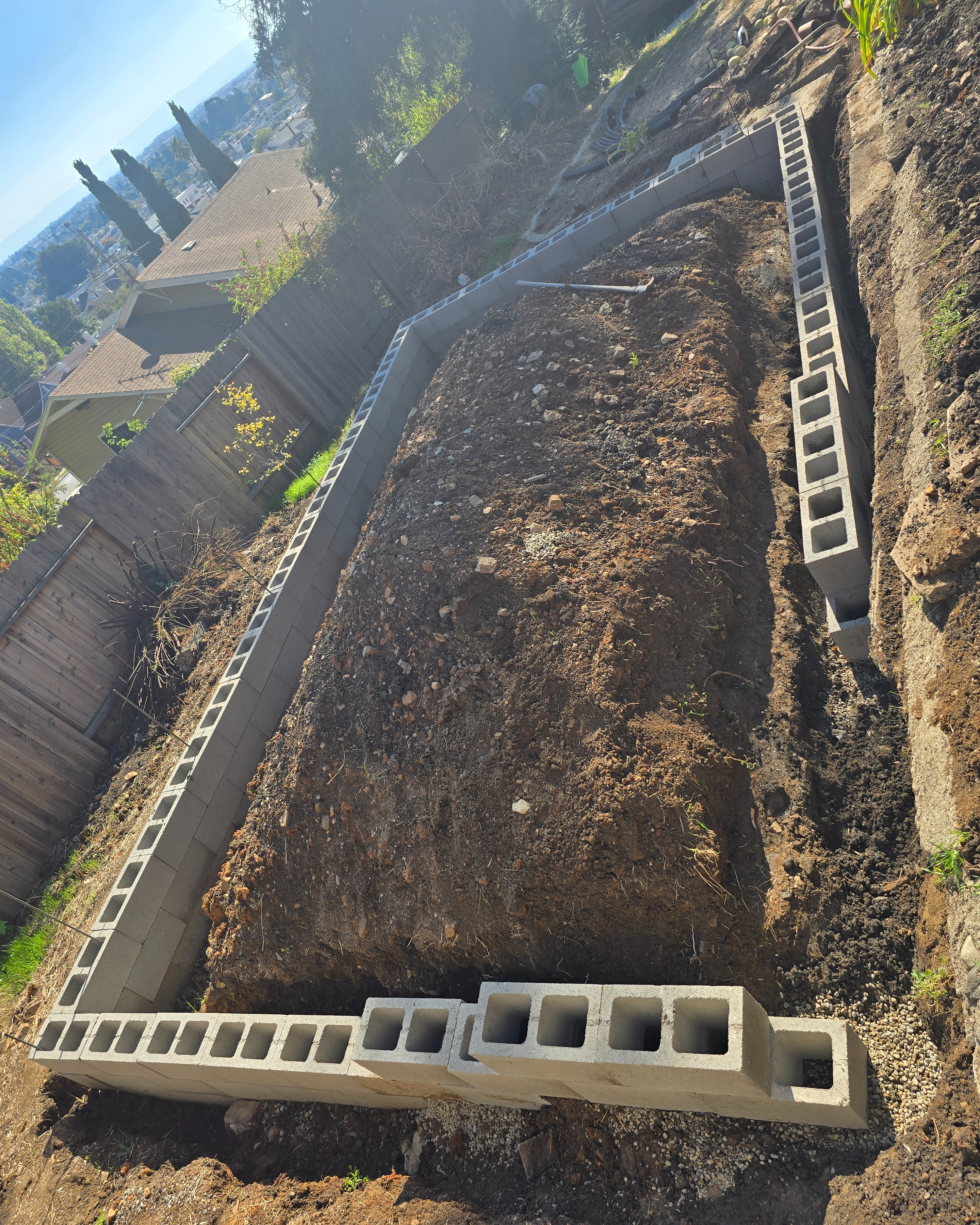 Block wall construction showing step up at the back