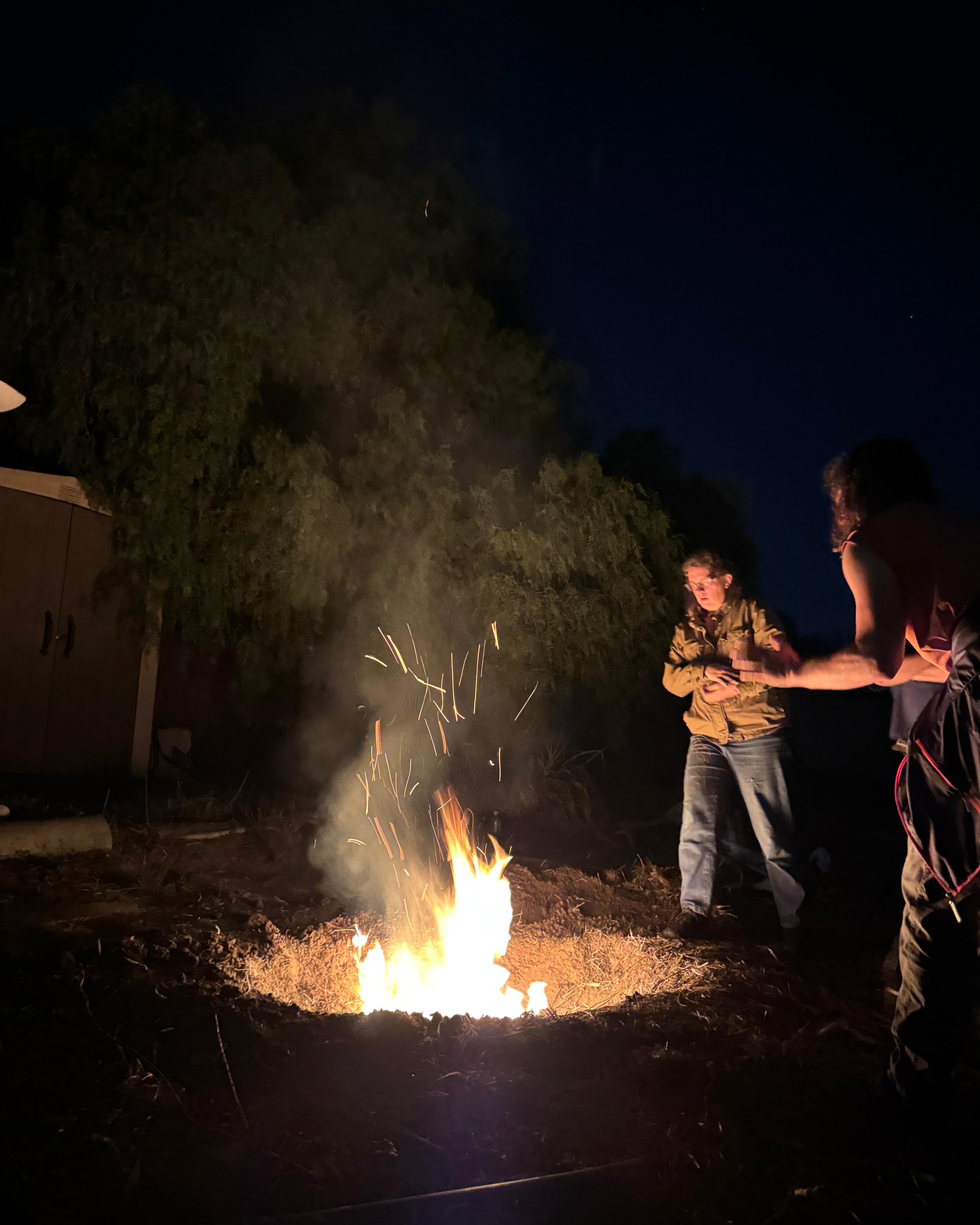 Conical burn pit with char